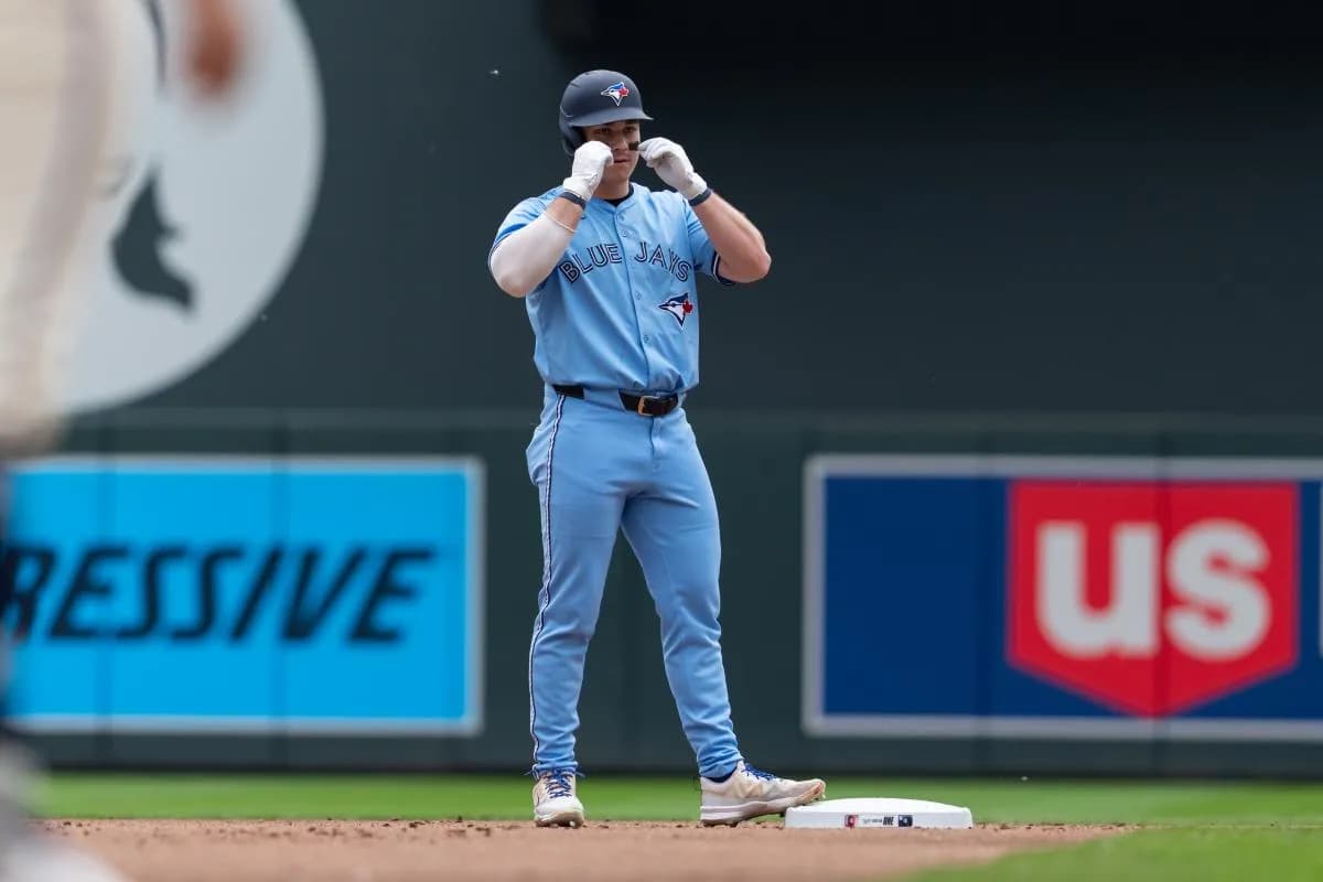 Toronto Blue Jays left fielder Alan Roden (18) reacts to hitting a RBI double during the second inning against the Minnesota Twins at Target Field.