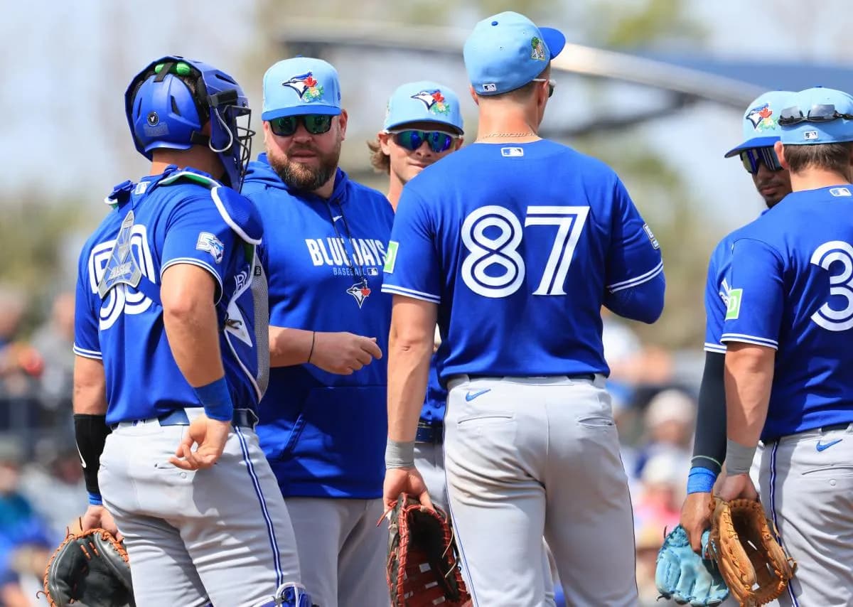 Toronto Blue Jays manager John Schneider (14) talks with catcher C.J. Stubbs (50) and first baseman Riley Triotta (87) on the mound during the second inning against the Toronto Blue Jays at Charlotte Sports Park