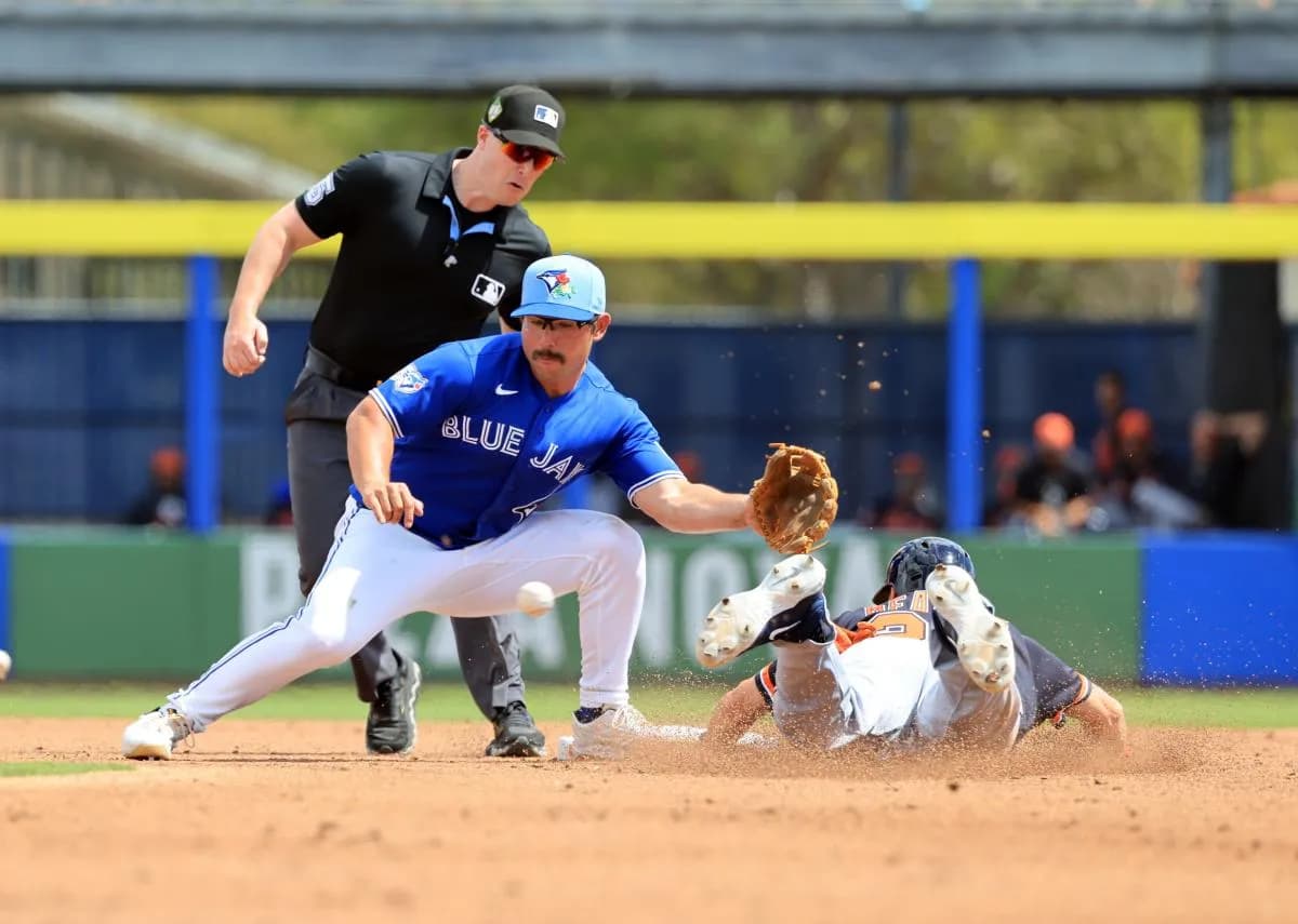 Detroit Tigers designated hitter Parker Meadows (22) steals second base as Toronto Blue Jays second baseman Davis Schneider (36) attempted to tag him out during the second inning at TD Ballpark.