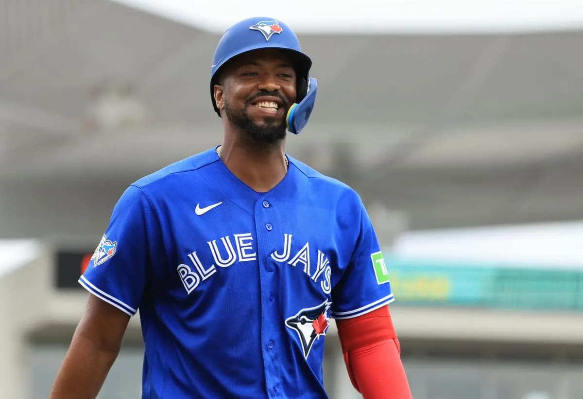 Toronto Blue Jays designated hitter Eloy Jimenez (74) smiles after he checks on the balls and strikes during the third inning against the Boston Red Sox at JetBlue Park at Fenway South.