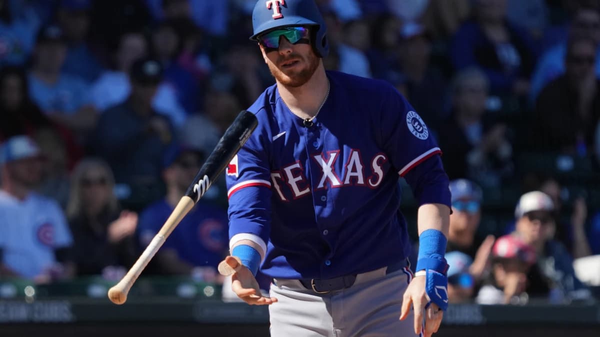 Texas Rangers catcher Danny Jansen (9) reacts after striking out against the Chicago Cubs in the first inning at Sloan Park.