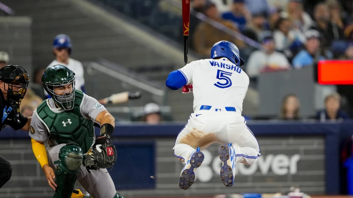 Toronto Blue Jays center fielder Daulton Varsho (5) takes a bat against the Athletics during the eighth inning at Rogers Centre.