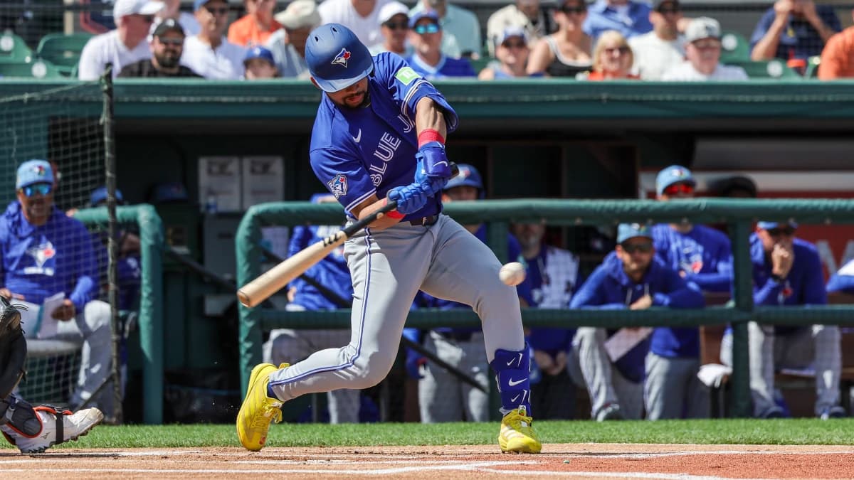 Toronto Blue Jays left fielder Jonatan Clase (8) hits during the first inning against the Detroit Tigers at Publix Field at Joker Marchant Stadium.
