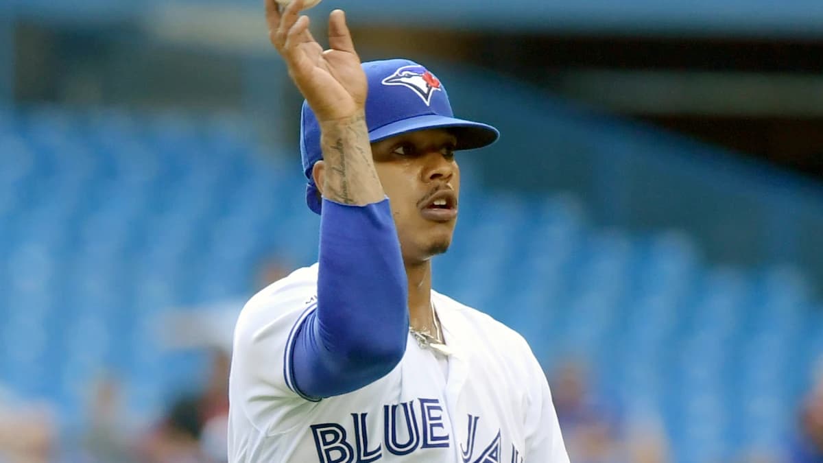 Toronto Blue Jays pitcher Marcus Stroman (6) flips the ball to first base after fielding a ball hit by Kansas City Royals shortstop Humberto Arteaga (not pictured) in the fourth inning at Rogers Centre.