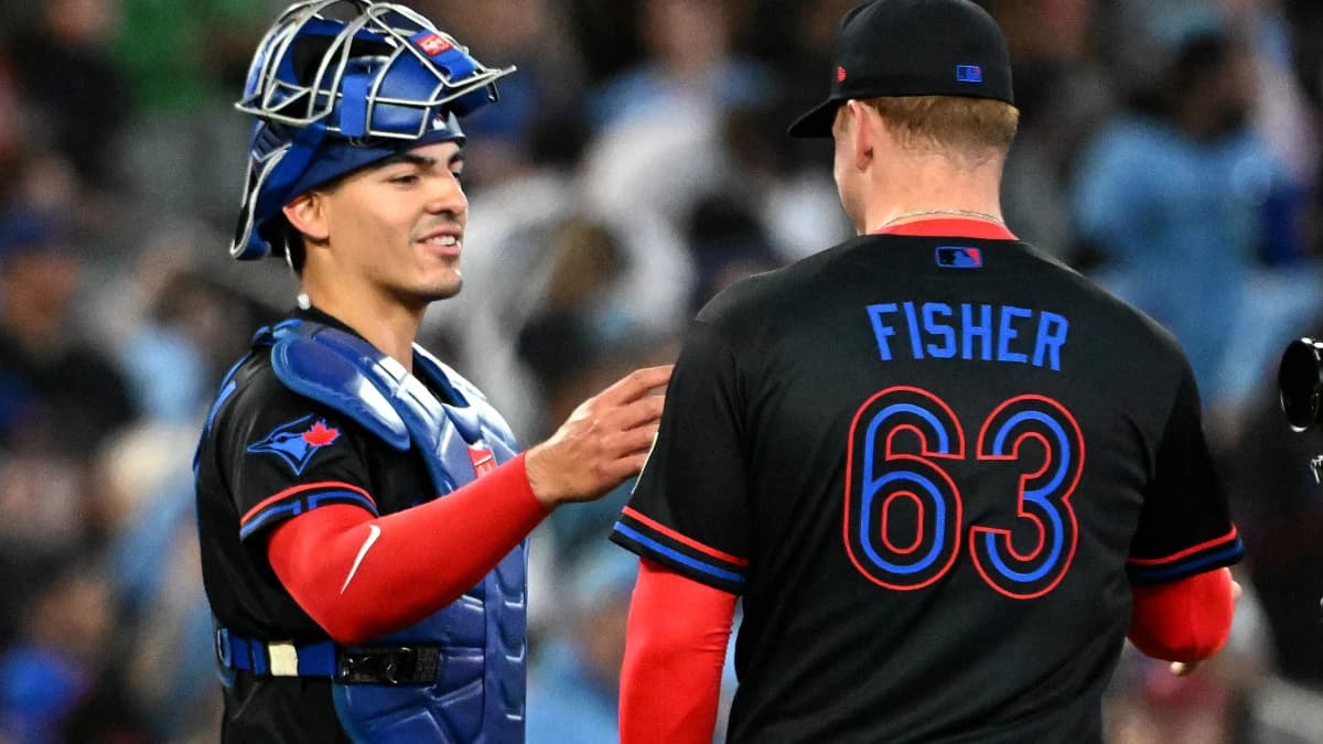 Toronto Blue Jays catcher Brandon Valenzuela (59) and relief pitcher Braydon Fisher (63) celebrate a win over the Minnesota Twins at Rogers Centre.