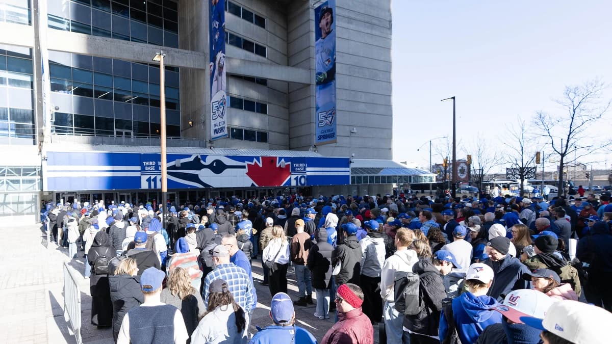 Fans wait in line before the Opening Day game between the Athletics and Toronto Blue Jays at Rogers Centre.