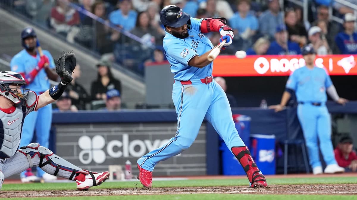 Toronto Blue Jays first baseman Vladimir Guerrero Jr. (27) hits a single against the Minnesota Twins during the ninth inning at Rogers Centre.