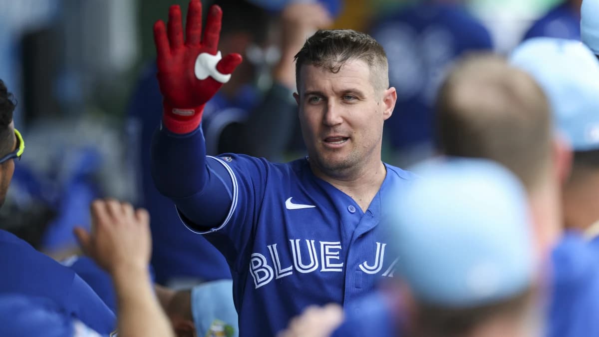 Toronto Blue Jays catcher Tyler Heineman (55) races after hitting a home run against the Philadelphia Phillies in the first inning during spring training at BayCare Ballpark.