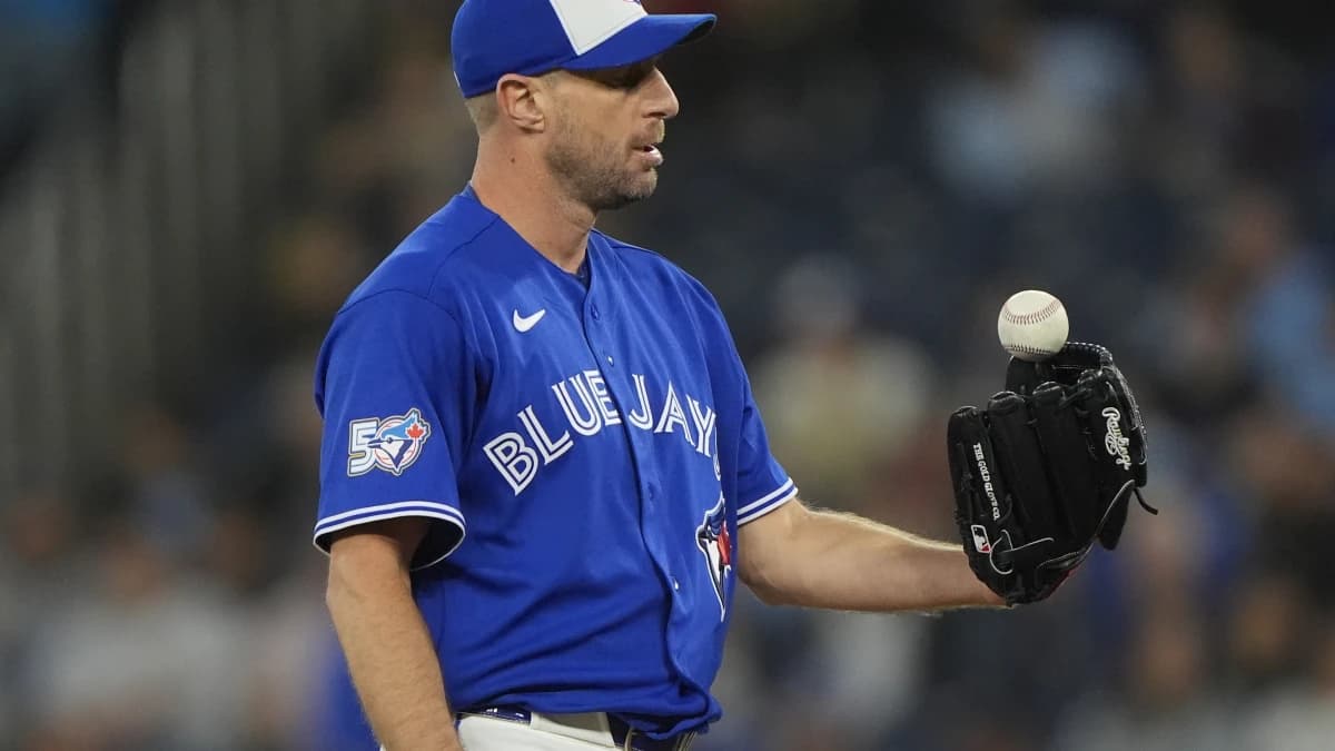Toronto Blue Jays starting pitcher Max Scherzer (31) flips a ball out of his glove before throwing a pitch to the Minnesota Twins during the second inning at Rogers Centre.
