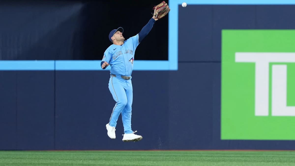 Toronto Blue Jays center fielder Daulton Varsho (5) is unable to catch a fly ball against the Minnesota Twins during the third inning at Rogers Centre.