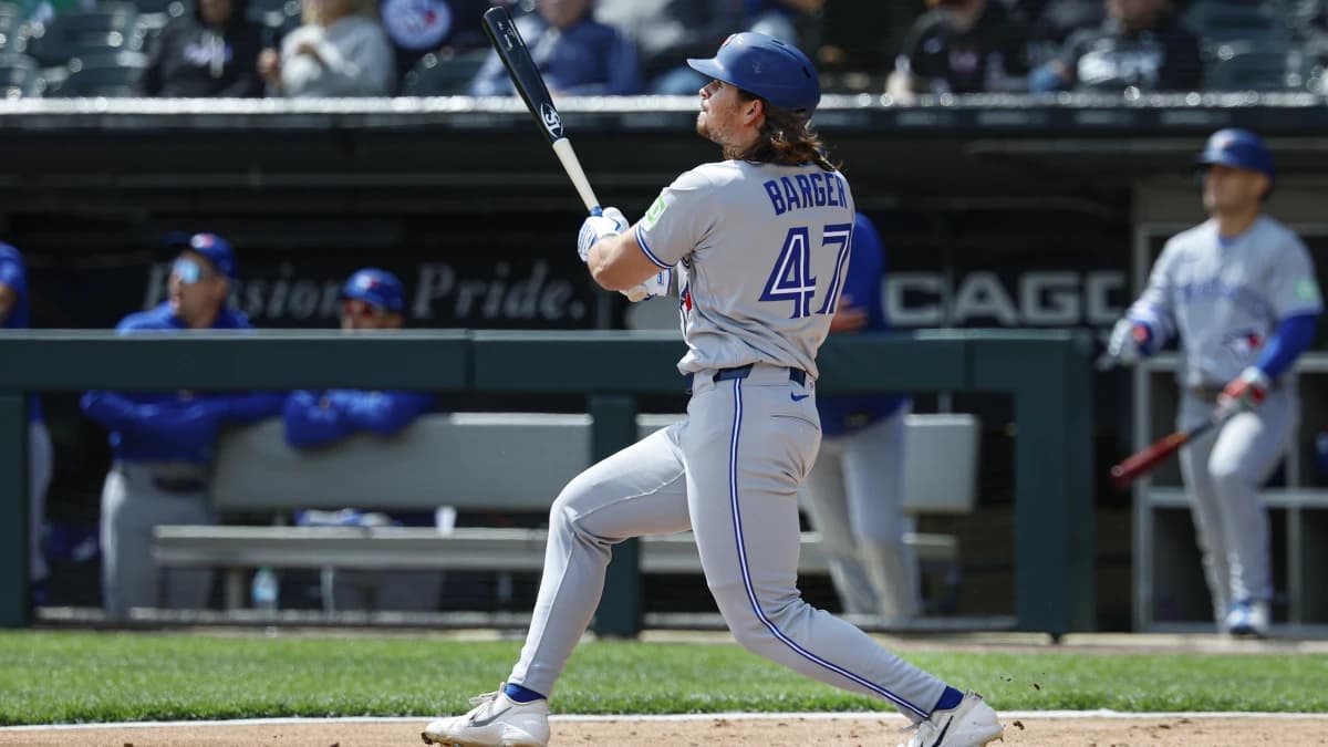 Toronto Blue Jays right fielder Addison Barger (47) hits a double against the Chicago White Sox during the second inning at Rate Field.