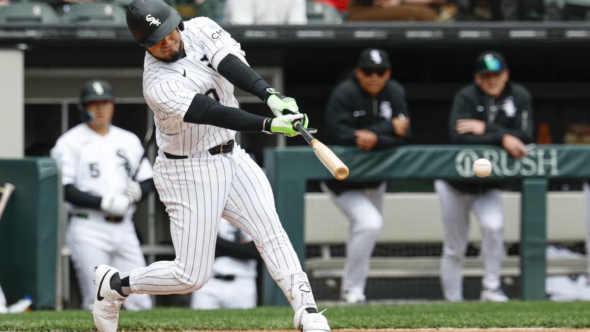 Chicago White Sox designated hitter Lenyn Sosa (50) hits a single against the Toronto Blue Jays during the first inning at Rate Field.