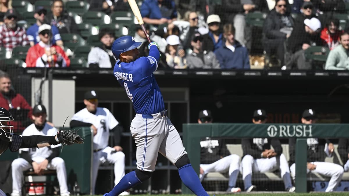 Toronto Blue Jays right fielder George Springer (4) singles during the fifth inning against the Chicago White Sox at Rate Field.