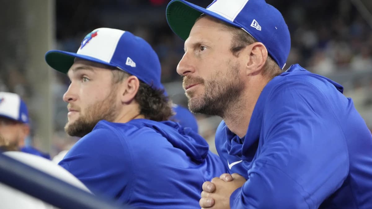 Toronto Blue Jays pitcher Trey Yesavage (39) and pitcher Max Scherzer (31) in the dugout before the start of the game against the Athletics at Rogers Centre.