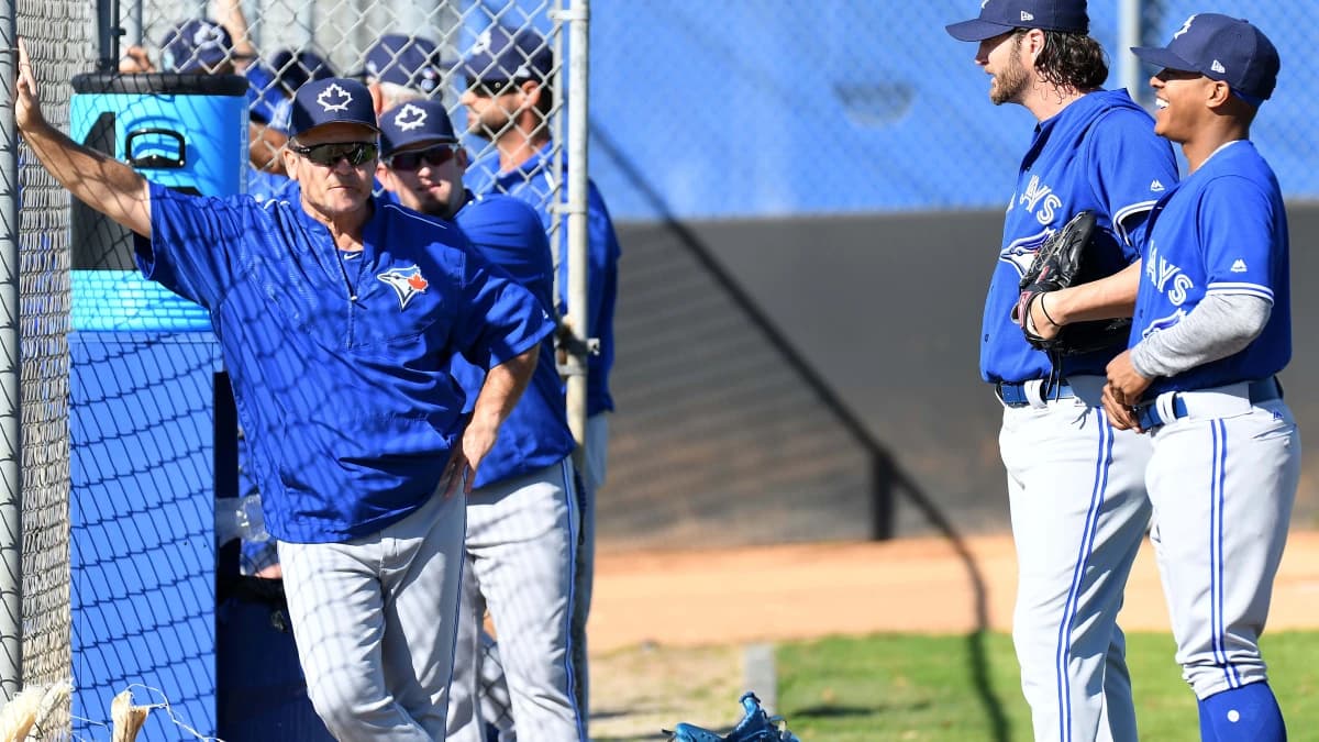 Toronto Blue Jays manager Josh Gibbons (5) talks with Toronto Blue Jays pitcher Marcus Stroman (6) and Toronto Blue Jays pitcher Jason Grilli (37) during the spring training workout at the Bobby Mattix Training Center.