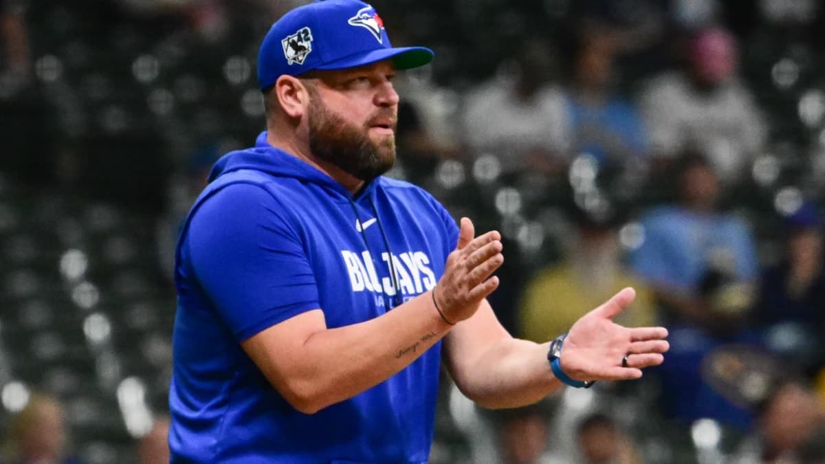 Toronto Blue Jays manager John Schneider makes a pitching change in the seventh inning against the Milwaukee Brewers at American Family Field