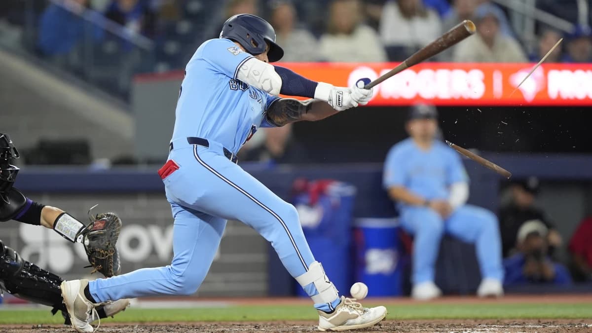 Toronto Blue Jays right fielder Nathan Lukes (38) breaks his bat on a foul ball against the Colorado Rockies during the tenth inning at Rogers Centre.
