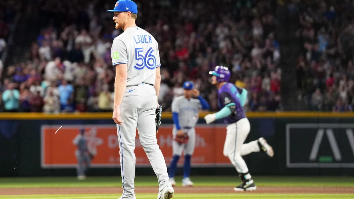 Toronto Blue Jays pitcher Eric Lauer (56) reacts after giving up a solo home run to Arizona Diamondbacks third baseman Nolan Arenado (28) during the fourth inning at Chase Field.