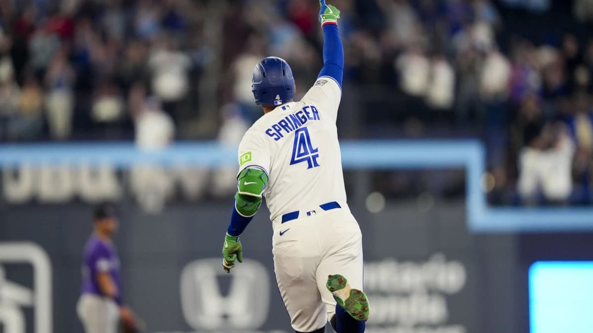 Toronto Blue Jays George Springer (4) celebrates hitting a home run against the Colorado Rockies during the third inning at Rogers Centre.