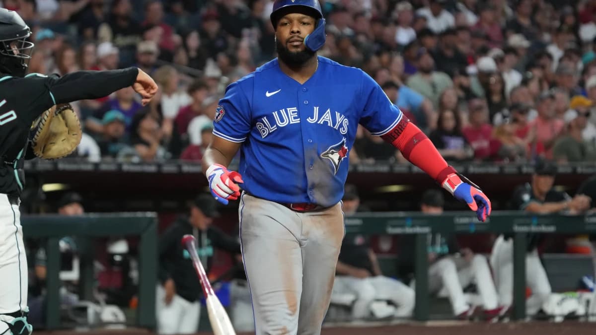 Toronto Blue Jays first baseman Vladimir Guerrero Jr. (27) throws his bat after striking gout against the Arizona Diamondbacks in the seventh inning at Chase Field.