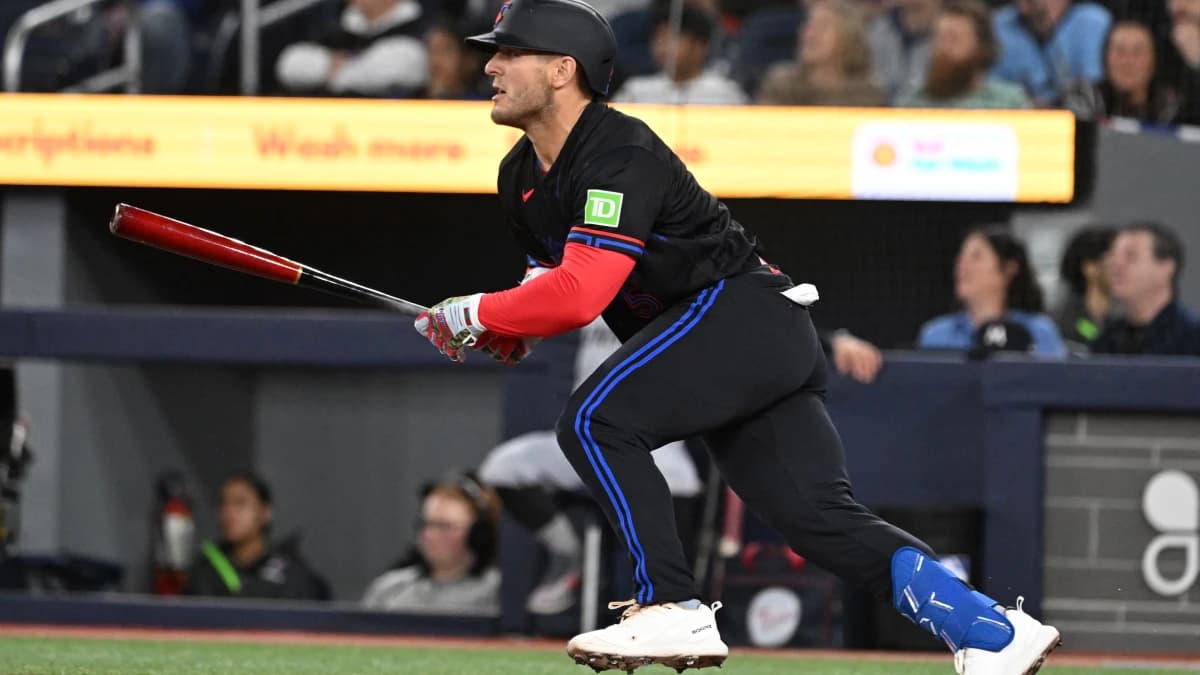 Toronto Blue Jays center fielder Daulton Varsho (5) hits a double against the Minnesota Twins in the first inning at Rogers Centre.