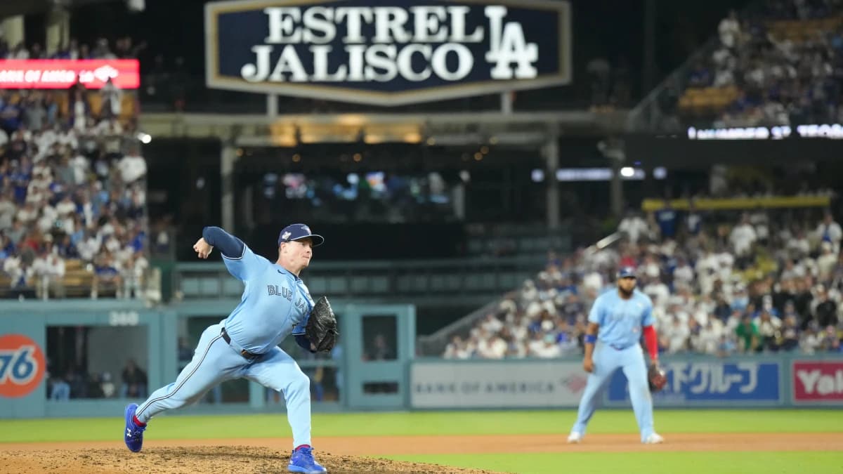 Toronto Blue Jays pitcher Louis Varland (77) pitches during the ninth inning against the Los Angeles Dodgers during game four of the 2025 MLB World Series at Dodger Stadium
