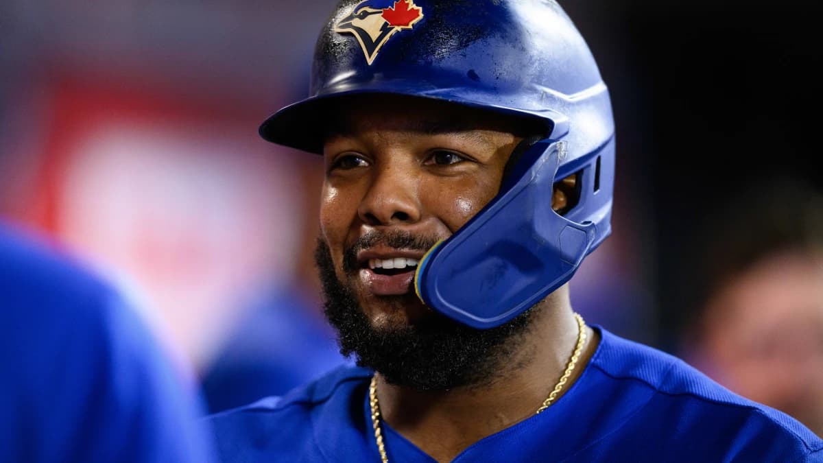 Toronto Blue Jays first baseman Vladimir Guerrero Jr. (27) is greeted by teammates after scoring during the sixth inning against the Los Angeles Angels at Angel Stadium.