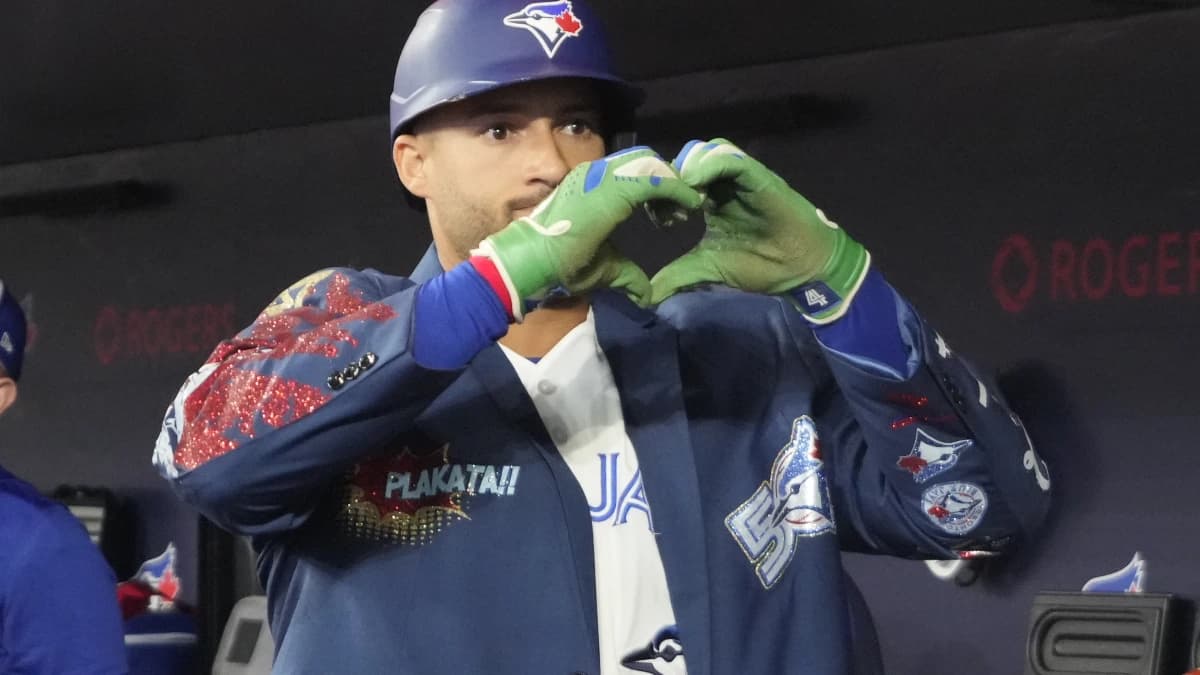 Toronto Blue Jays designated hitter George Springer (4) shows the heart symbol after his solo home run against the Athletics in the first inning at Rogers Centre.