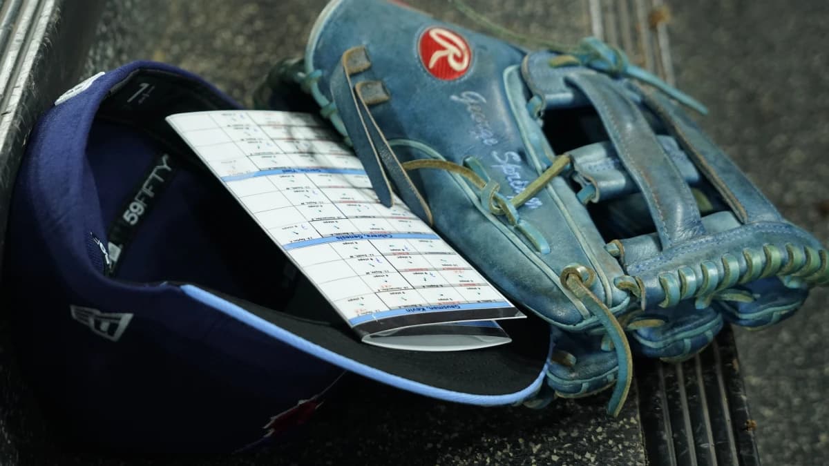 The glove, player information card and hat of Toronto Blue Jays right fielder George Springer (not pictured) in the dugout of a game against the Los Angeles Dodgers at Rogers Centre.