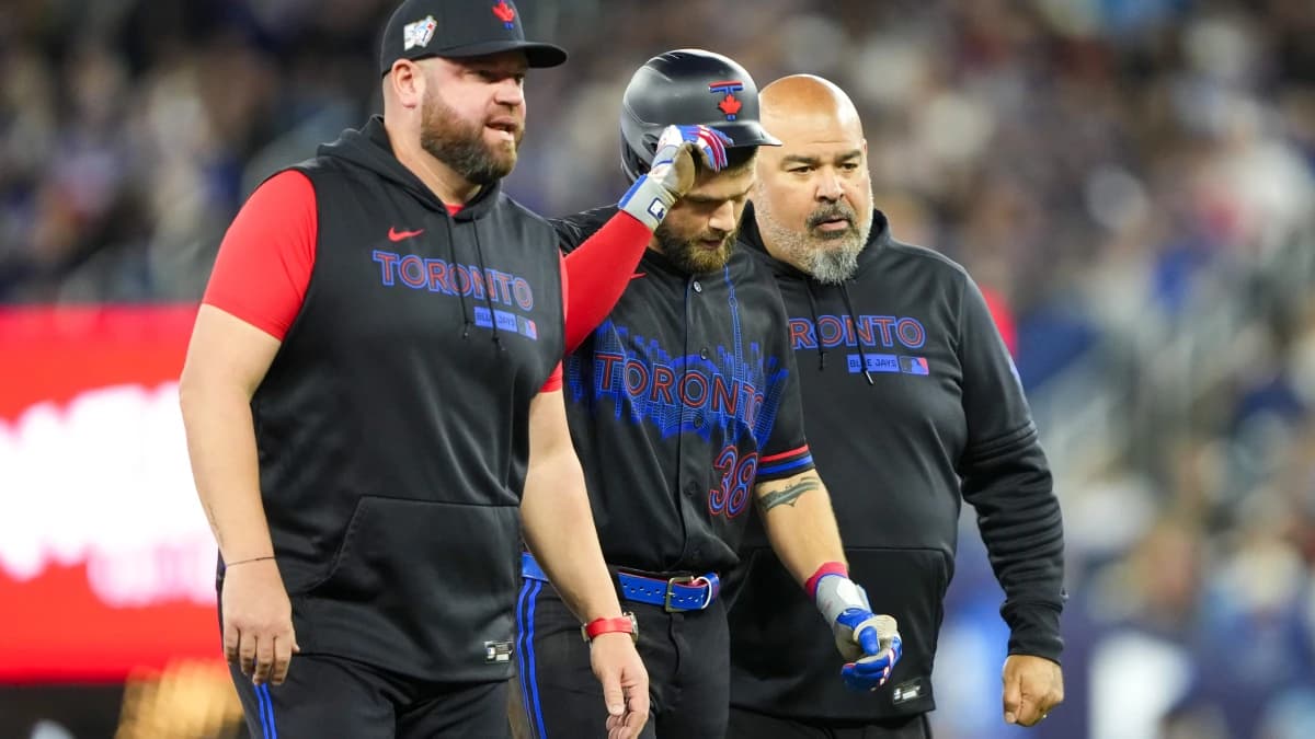 Toronto Blue Jays right fielder Nathan Lukes (38) leaves the game after sliding into second base against the Cleveland Guardians during the first inning at Rogers Centre.