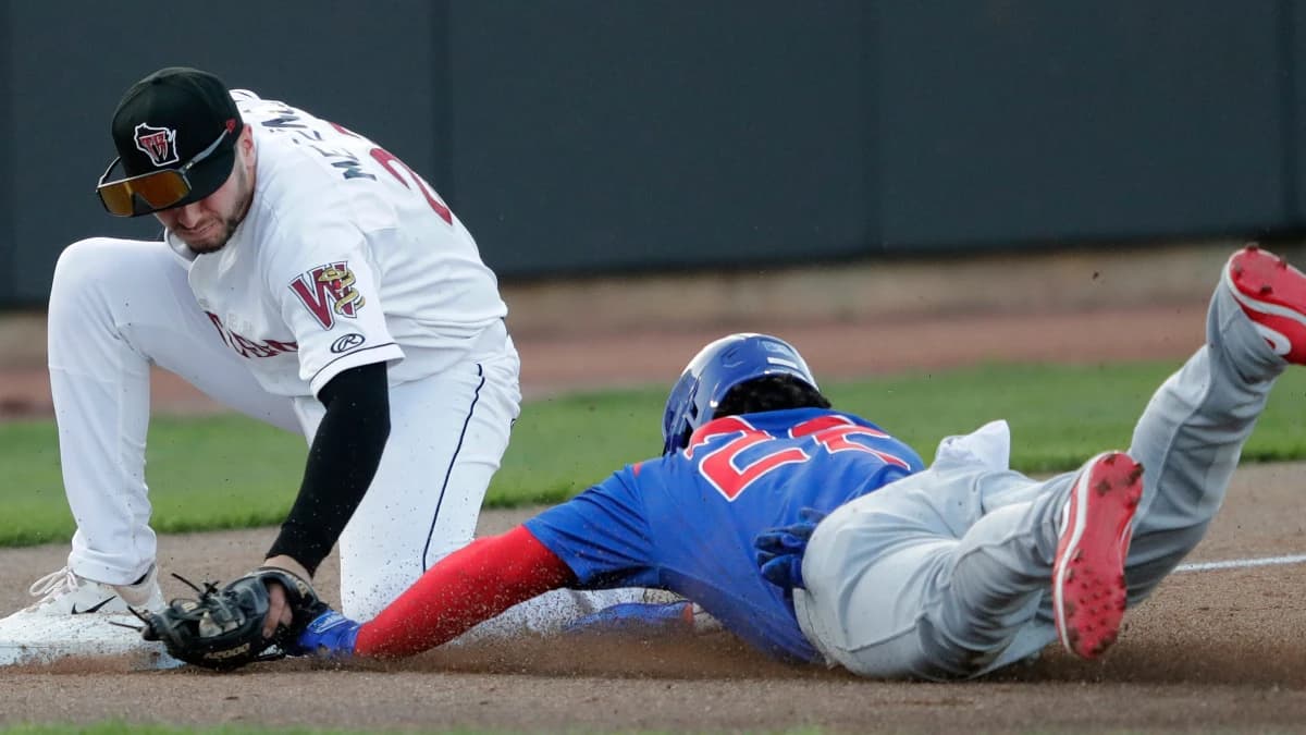 Wisconsin Timber Rattlers' Ben Metzinger (23) tags out South Bend Cubs Yohendrick Pinango (22) during their baseball game Wednesday, May 10, 2023, at Neuroscience Group Field at Fox Cities Stadium in Grand Chute, Wis. Dan Powers/USA TODAY NETWORK-Wisconsin.