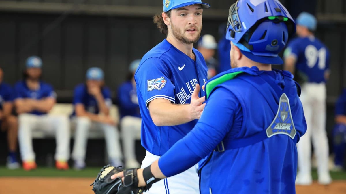 Toronto Blue Jays pitcher Trey Yesavage (39) and catcher Alejandro Kirk (30) greet after the bullpen session for spring training practice at Blue Jays Player Development Complex.