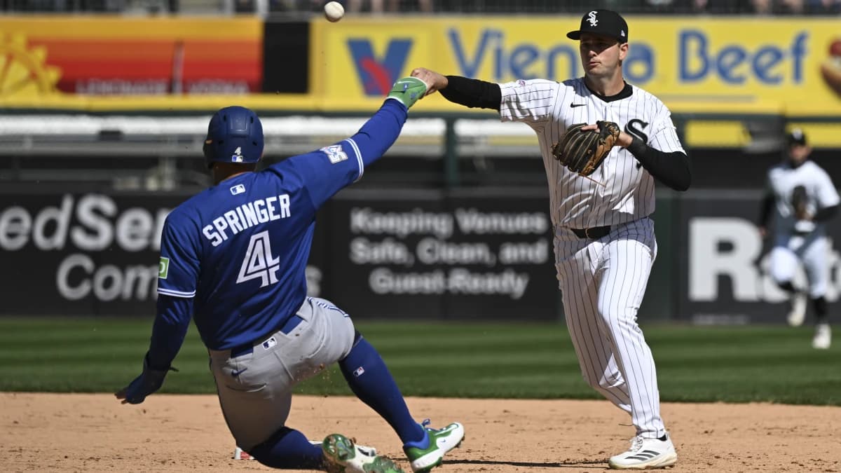 Chicago White Sox shortstop Tanner Murphy throws a double play after forcing out Toronto Blue Jays right fielder George Springer (4) during the fifth inning at Rate Field.