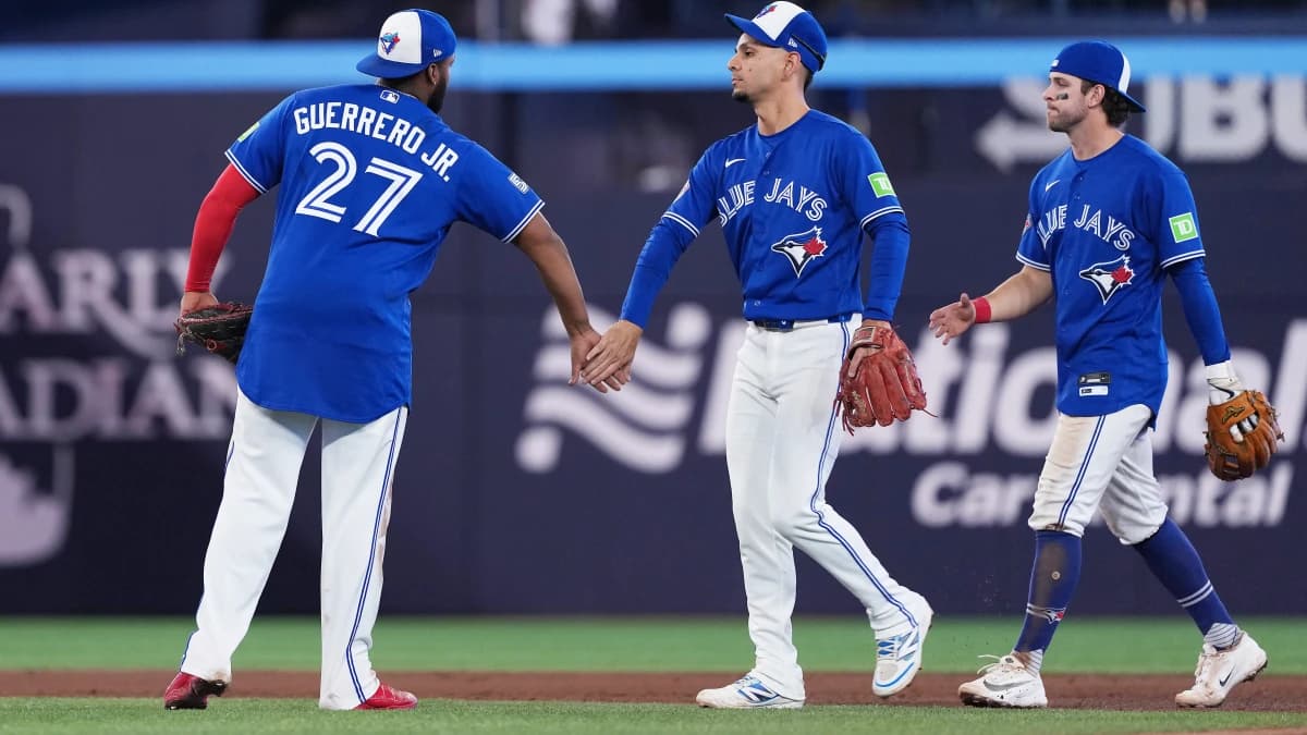 Toronto Blue Jays first baseman Vladimir Guerrero Jr. (27) celebrates the win with shortstop Andres Gimenez (0) against the Cleveland Guardians at the end of the ninth inning at Rogers Centre.