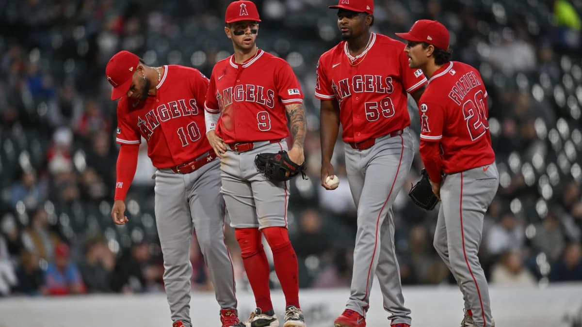 Los Angeles Angels pitcher Jose Soriano (59) meets with third baseman Yoan Moncada (10), shortstop Zach Neto (9) and baseman Adam Frazier (20) at the mound against the Chicago White Sox during the third inning at Rate Field.