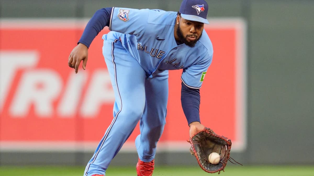 Toronto Blue Jays first baseman Vladimir Guerrero Jr. (27) fields a ground ball from Minnesota Twins designated hitter Josh Bell (56) in the sixth inning at Target Field.