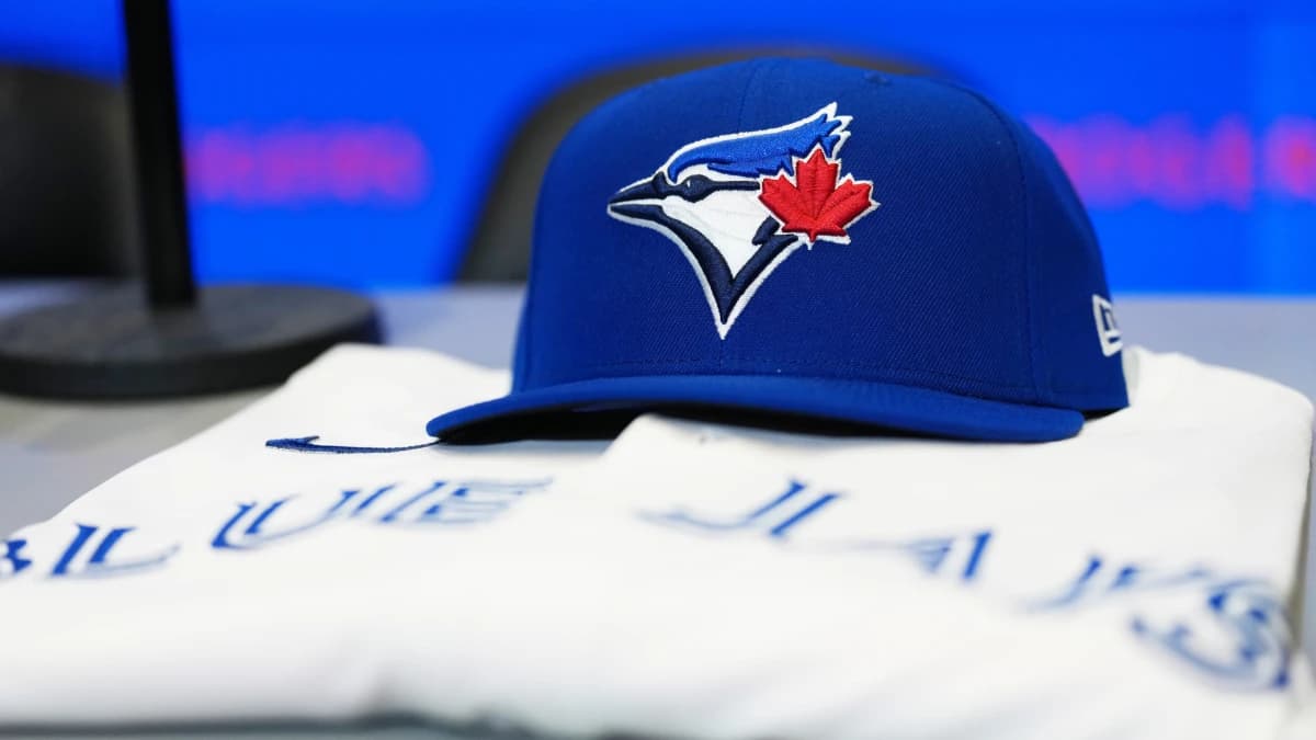 The baseball cap and jersey sit on the table before the press conference of Toronto Blue Jays Kazuma Okamoto (not pictured) at Rogers Centre.