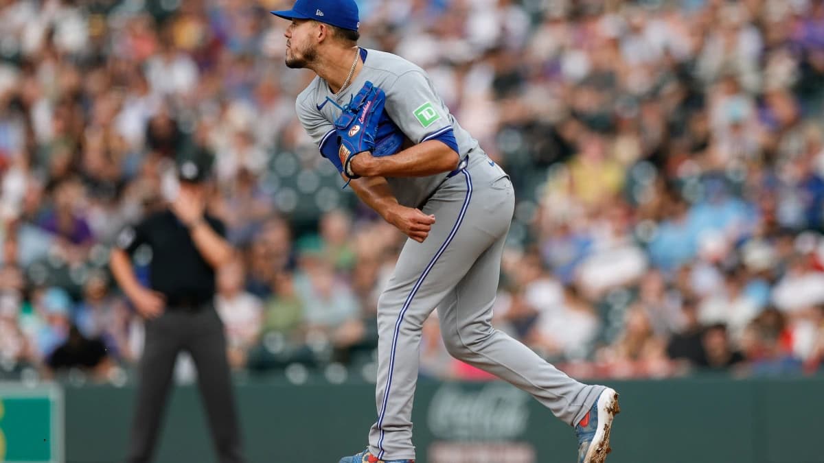 Toronto Blue Jays starting pitcher Jose Berrios (17) throws to second for a pick off to end the third inning against the Colorado Rockies at Coors Field.