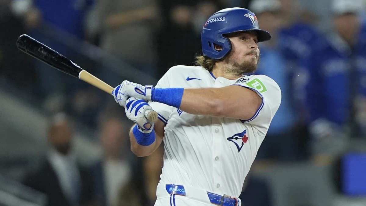 Toronto Blue Jays third baseman Addison Barger (47) hits a single against the Los Angeles Dodgers in the second inning during game seven of the 2025 MLB World Series at Rogers Centre.