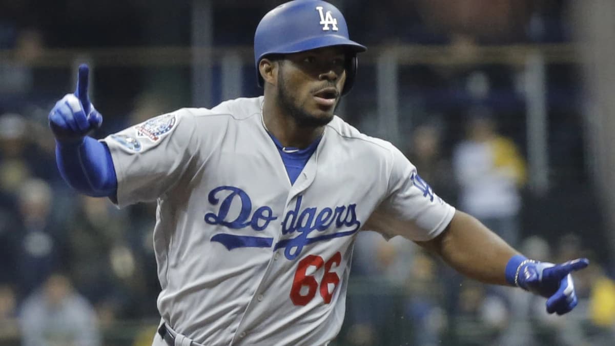 Los Angeles Dodgers outfielder Yasiel Puig (66) celebrates after hitting a three-run home run against the Milwaukee Brewers in the sixth inning in game seven of the 2018 NLCS playoff baseball series at Miller Park.