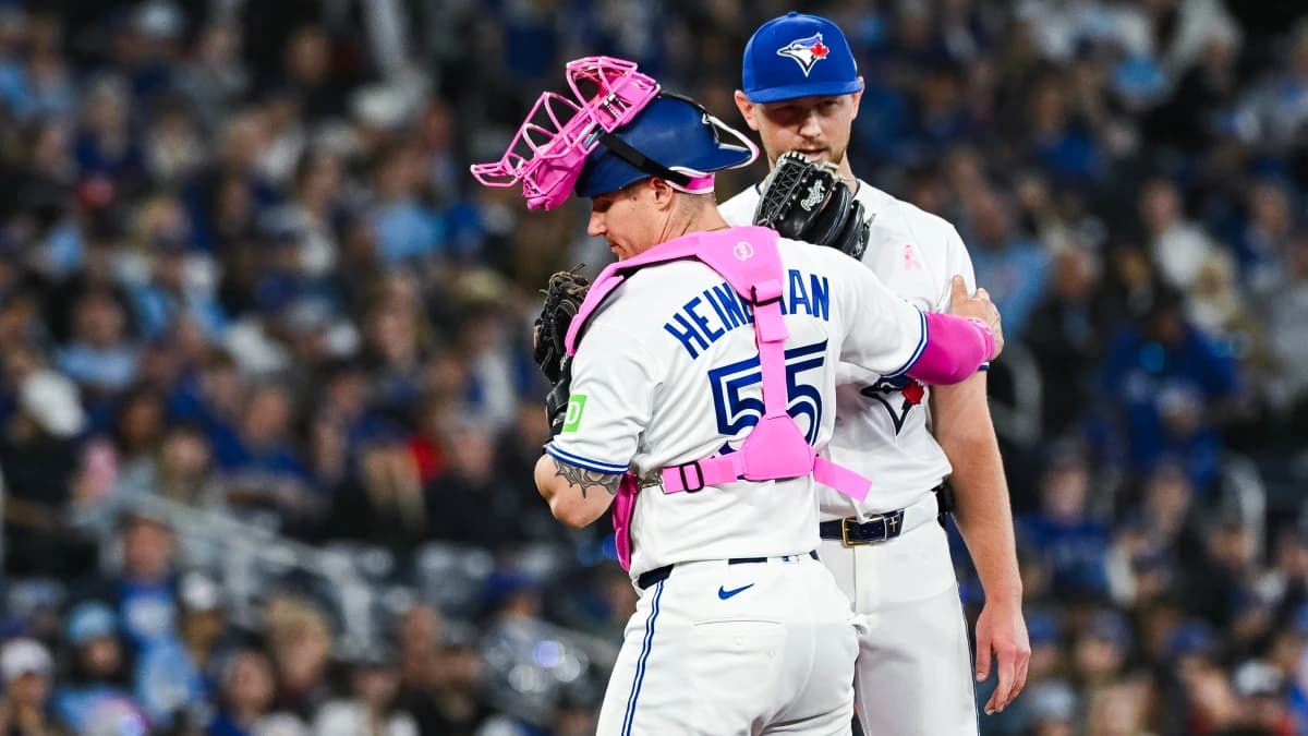 Toronto Blue Jays catcher Tyler Heineman (55) has a discussion with starting pitcher Eric Lauer (56) against the Los Angeles Angels in the fifth inning at Rogers Centre.