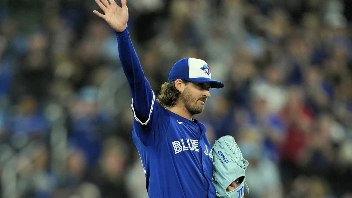 Toronto Blue Jays starting pitcher Kevin Gausman (34) waves to the fans after he is acknowledged for getting his 2,000th career strike out during the fourth inning against the Tampa Bay Rays at Rogers Centre.