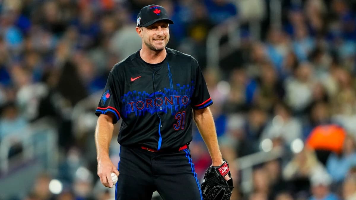 Toronto Blue Jays pitcher Max Scherzer (31) smiles in between pitches against the Cleveland Guardians at Rogers Centre.