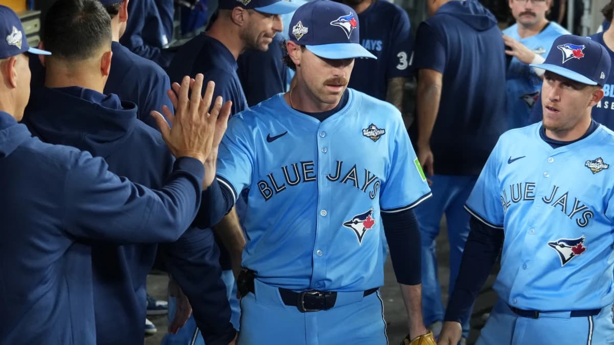 Toronto Blue Jays pitcher Shane Bieber (57) reacts in the dugout after being relieved in the sixth inning against the Los Angeles Dodgers during game four of the 2025 MLB World Series at Dodger Stadium.
