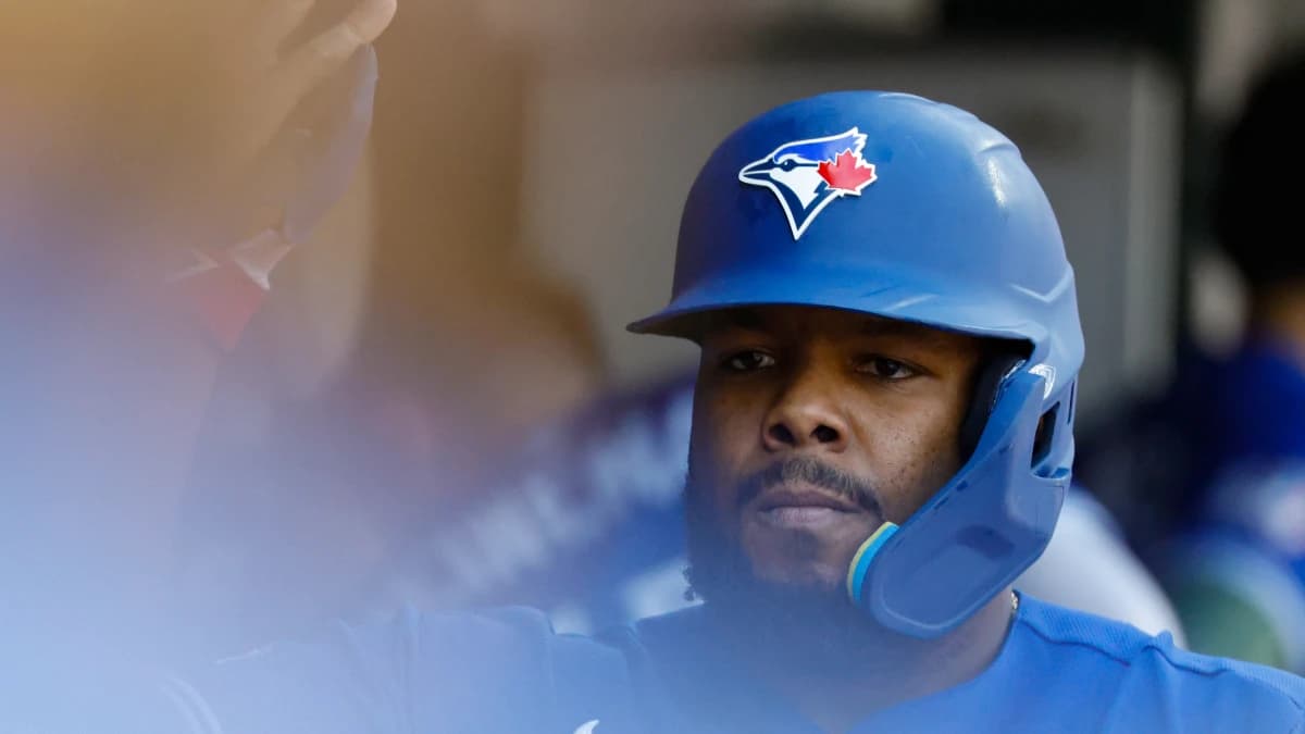 Toronto Blue Jays first baseman Vladimir Guerrero Jr. (27) receives congratulations from teammates after scoring tenth inning against the Detroit Tigers at Comerica Park.