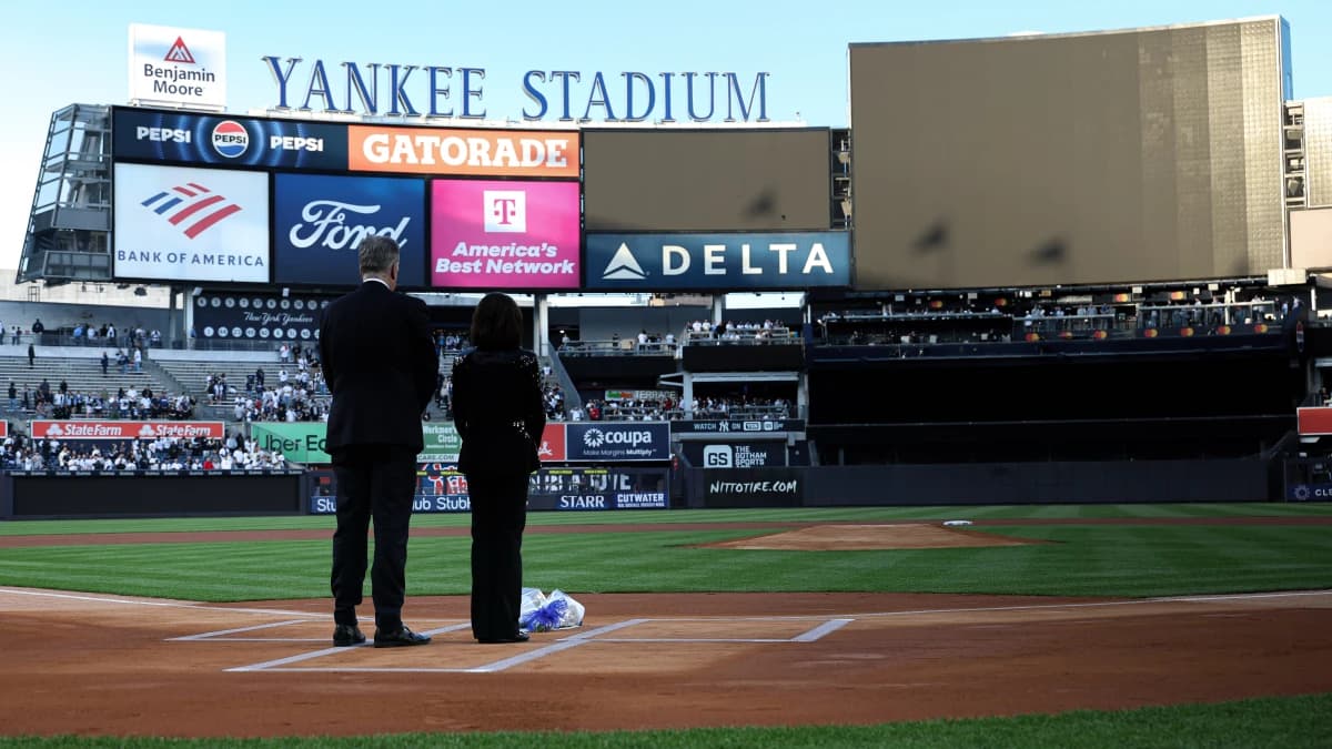 Broadcasters Michael Kay and Suzyn Waldman honor Yankees radio play-by-play announcer John Sterling before the game between the New York Yankees and the Baltimore Orioles at Yankee Stadium.