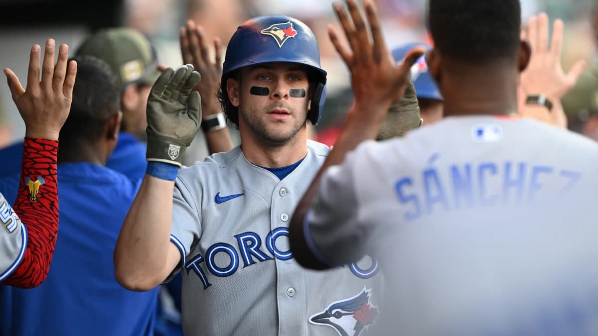 Toronto Blue Jays second baseman Ernie Clement (22) celebrates in the dugout after scoring a run against the Detroit Tigers in the second inning at Comerica Park.