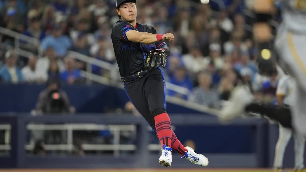 Toronto Blue Jays third baseman Kazuma Okamoto (7) throws out Pittsburgh Pirates left fielder Jake Mangum (28) at first base during the fifth inning at Rogers Centre.