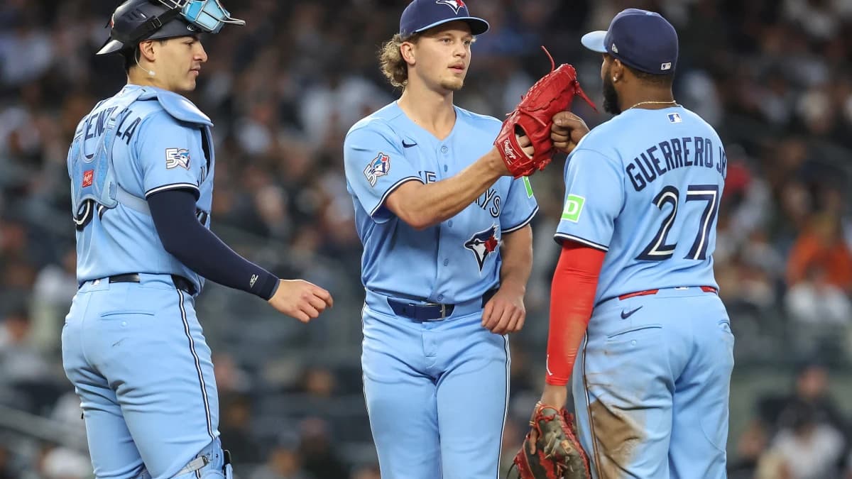 Toronto Blue Jays relief pitcher Adam MacKo (64) is greeted by catcher Brandon Valenzuela (59) and first baseman Vladimir Guerrero Jr. (27) after getting taken out of the game in the third inning against the New York Yankees at Yankee Stadium.