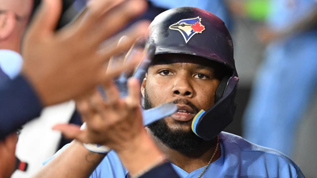 Toronto Blue Jays first baseman Vladimir Guerrero Jr. (27) celebrates with team mates in the dugout after scoring a run against the Pittsburgh Pirates in the sixth inning at Rogers Centre.